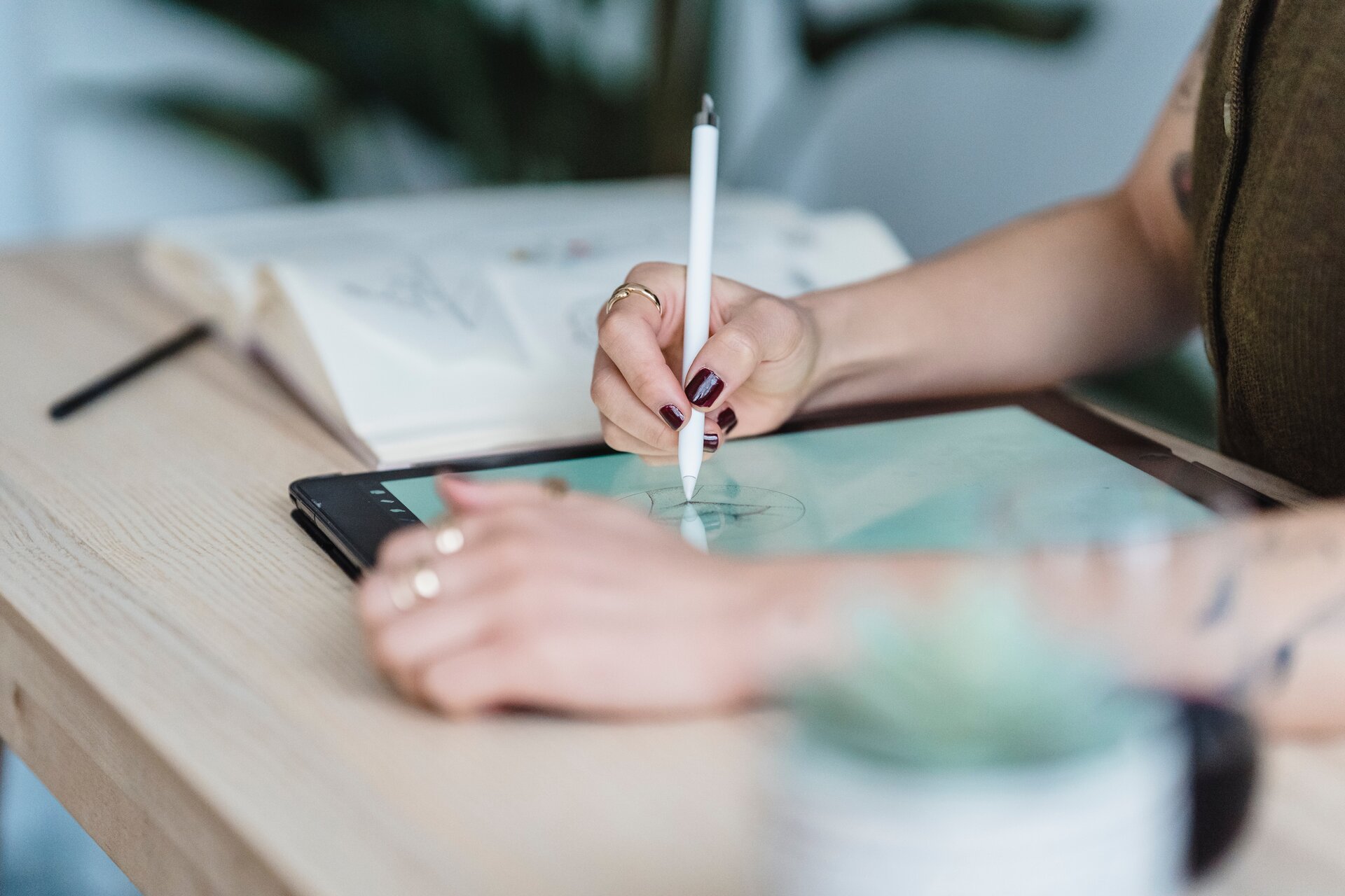 Woman writing on a tablet